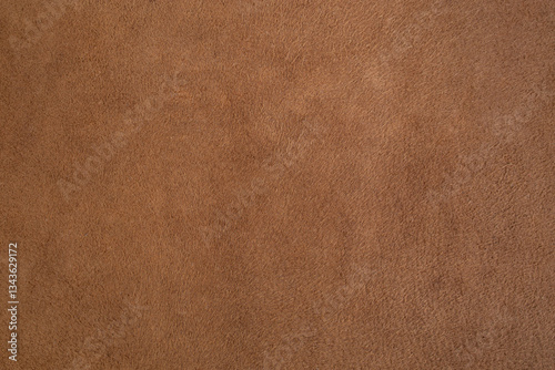 Genuine leather suede skin, textured surface, brown close up parchment structure , abstract backdrop
