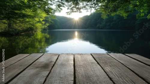 Obraz na płótnie Serene lake sunrise from a wooden dock. Lush forest canopy above tranquil water, sunbeams through the trees w salonie