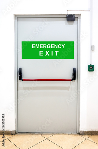 Emergency exit at shopping mall with inscription