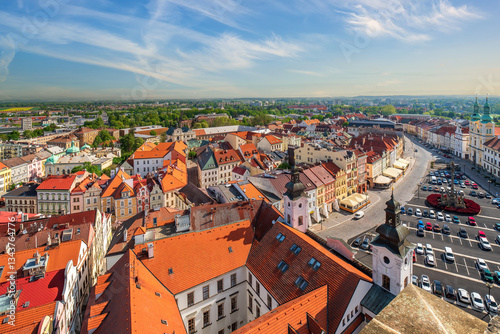 Scenic view on Great Square of Hradec Kralove, Czech Republic from White Tower. Towers and rooftop of city hall, plague column, renaissance old buildings and Assumption Church