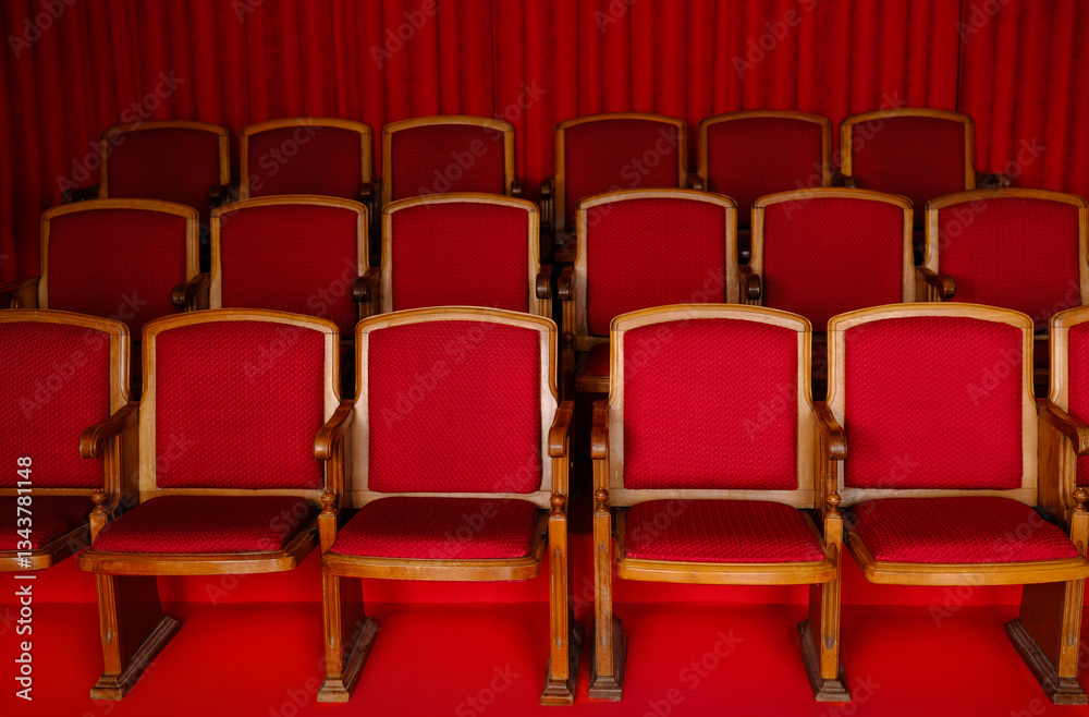 Fototapeta premium Vintage Theater Seats with Red Upholstery in Classic Cinema