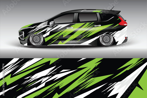 Sleek modified car with striking green and black graphics parked against a gradient background
