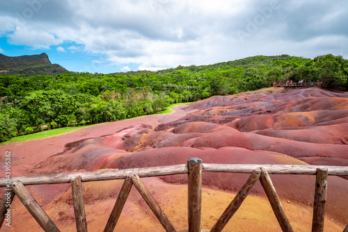 Scenic and beautiful view of amazingly colorful eroded dunes in a tropical jungle clearing at the Seven Colored Earth Geopark in Chamarel, Mauritius