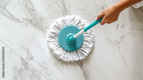 Top-Down View of a Cotton Spin Mop on Sleek Marble Flooring During Cleaning