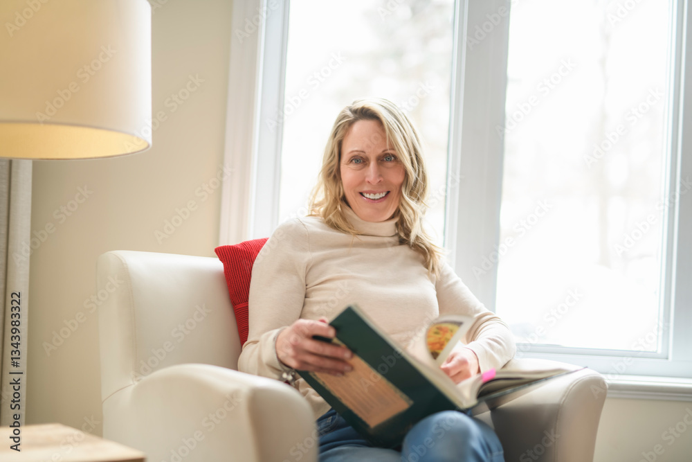 Relaxing at Home Woman Reading Book on Couch in Front of Plant in Cozy Living Room Setting Relaxing at Home Woman Reading Book on Couch in Front of Plant in Cozy Living Room Setting