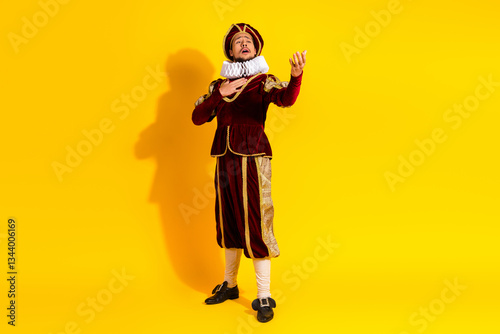 Young nobleman in historical attire performing dramatically, contrasted with vibrant yellow modern background photo