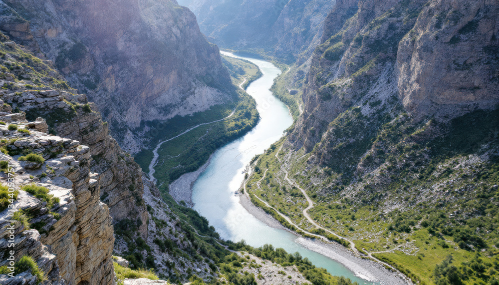 Serene River Winding Through Majestic Mountains
