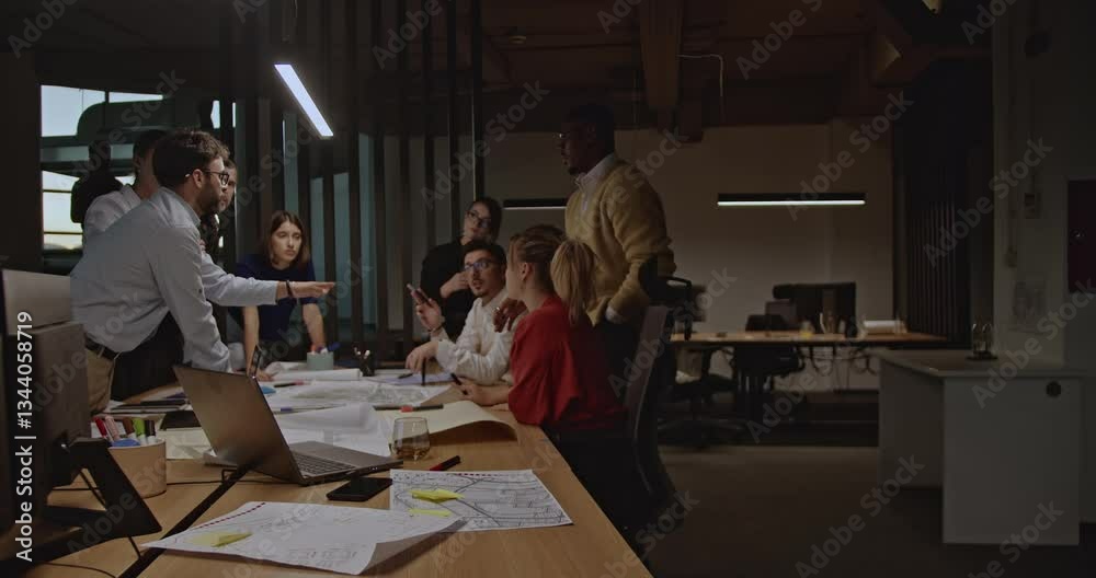A diverse team of business professionals collaborates on a project in a modern office, reviewing blueprints and engaging in discussions. A diverse team of business professionals collaborates on a project in a modern office, reviewing blueprints and engaging in discussions.