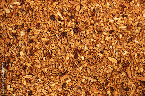 Golden Brown Homemade Granola with Nuts, Seeds and Raisins. 