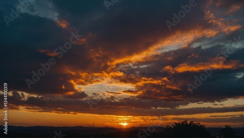 Vivid Sunset Sky with Fiery Orange Clouds over a Silhouetted Landscape, Abstract View