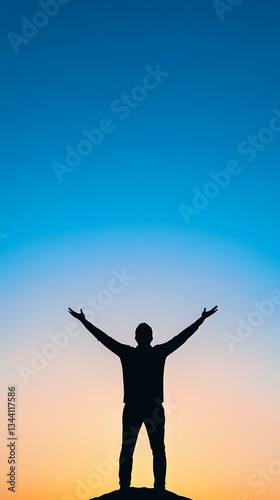 Wallpaper Mural Silhouette of man with raised arms against vibrant blue and orange sunset sky, standing on hill expressing freedom, achievement and life success. Torontodigital.ca