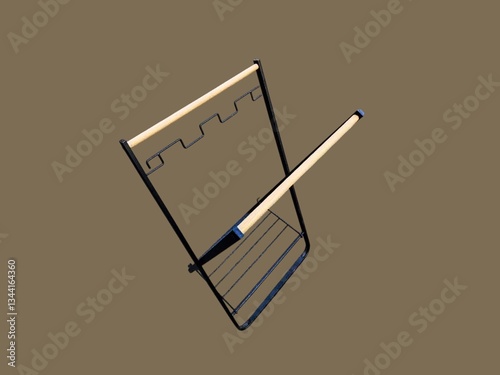 The brown background in the picture is a garbage bag hanger with a black iron frame and a wooden handle. It is used to hang garbage bags for use in the kitchen. It is lightweight and has a solid.
