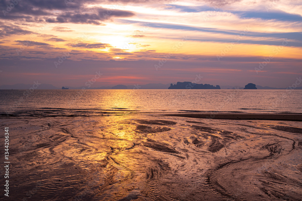 tourist watching sunset or sunrise on beach with seascape and gold lighting sunset sky background