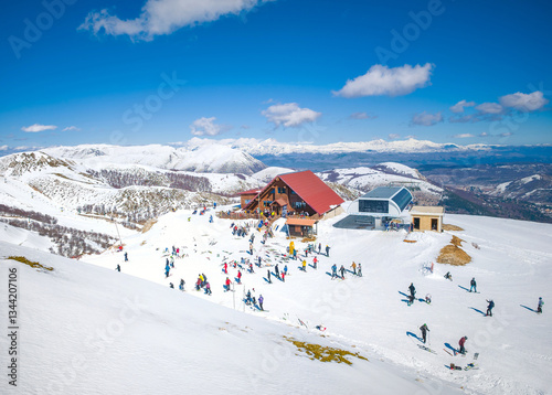 Ovindoli (Abruzzo, Italy) - The Monte della Magnola is a imponent and suggestive mountain peak in Abruzzo, above the ski resorts of Ovindoli, here during the winter with snow and alpinists. photo