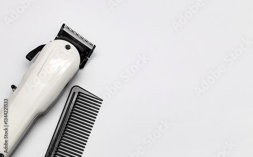 Hairdressing and barber tools. Professional comb and hairdressing clipper. The concept of hair care and professional grooming. Copy space for marketing materials, banners and social networks.