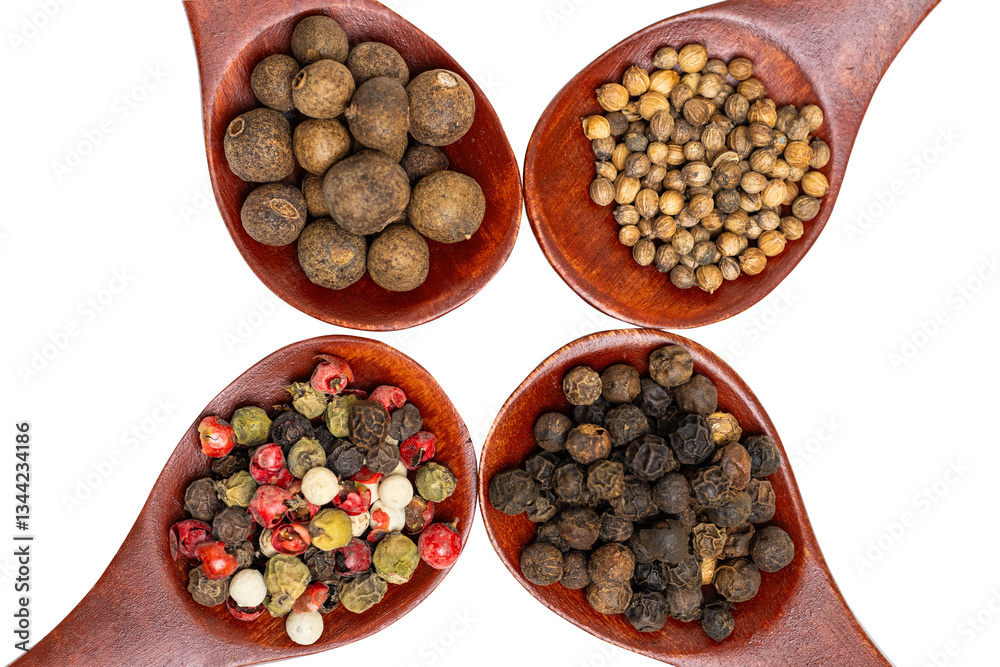 different spices in a wooden spoon