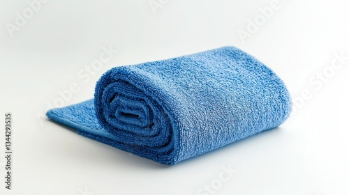 A roll of soft microfiber cloth placed on a white background.