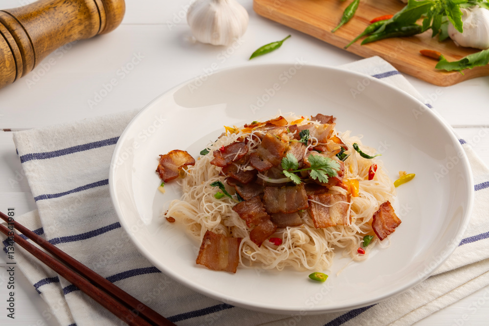 Stir Fried Rice Vermicelli with Bacon chilli and Holy Basil Seasoning in white plate. Stir Fried Rice Vermicelli with Bacon chilli and Holy Basil Seasoning in white plate.