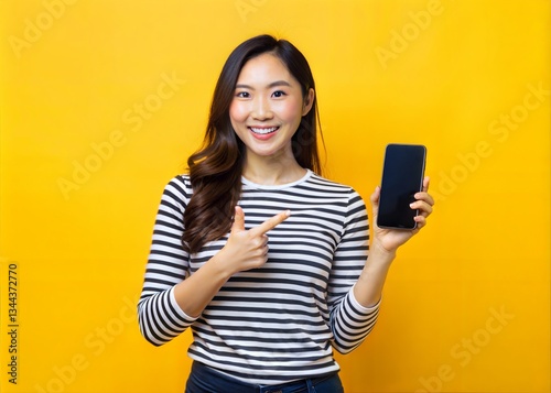 Smiling Woman Holding Phone and Pointing, Ready to Showcase