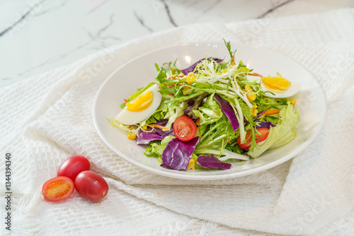 Mixed fruit and vegetable salad on a simple background