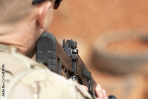 Focused Precision: Soldier Aiming a Rifle