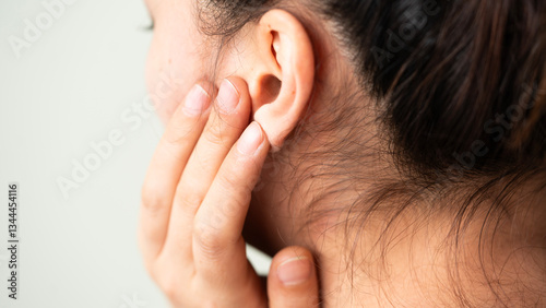 Young woman suffering from pain