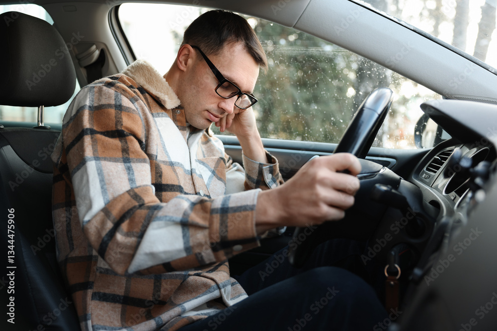 Tired driver sleeping in his modern car Tired driver sleeping in his modern car