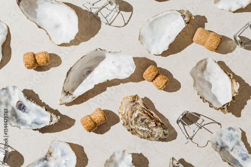 Wallpaper Mural Creative composition made of oyster shells, champagne corks and metal wire muselet on  pastel sunlit background with shadow. Party concept. Top view Torontodigital.ca