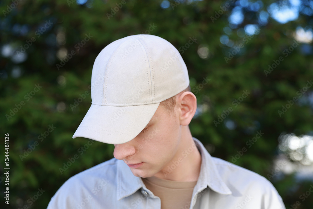 Man in stylish baseball cap outdoors. Mockup for design Man in stylish baseball cap outdoors. Mockup for design