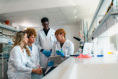 Professor holding a tablet, explaining scientific research concepts to a diverse group of students in lab coats, collaborating in a university laboratory focused on learning and innovation