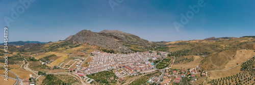 Aerial view of Valle de Abdalajis Village - Malaga Andalucía. Countryside of Spain. Typically, white village at mountain base, surrounded with agriculture field. Travel destination.