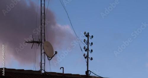 Rooftop Antenas In The City In A Cloudy Day