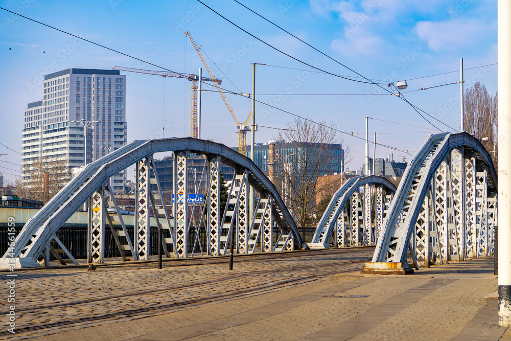 Obraz premium a town bridge in the city of Wrocław on the Oder. riveted steel bridges for car and tram traffic. urban transport. urban landscape