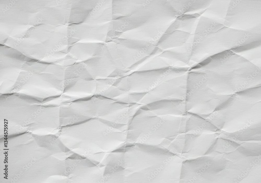 Fototapeta premium Crumpled White Paper Texture - Close-up shot of a crumpled piece of white paper, showing texture and creases. Ideal for backgrounds or design elements