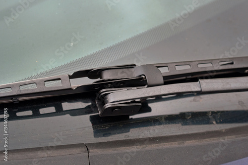 Obraz na płótnie Closeup of black offset adapter mounted on arm of wiper blade for effective rain and dirt removal. Windshield, wiper blade and adapter for optimal visibility during rain and bad weather w salonie