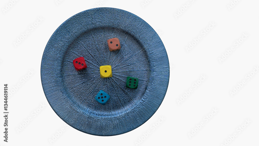 Four colorful dice are scattered on a textured blue plate, symbolizing the interplay of chance and control