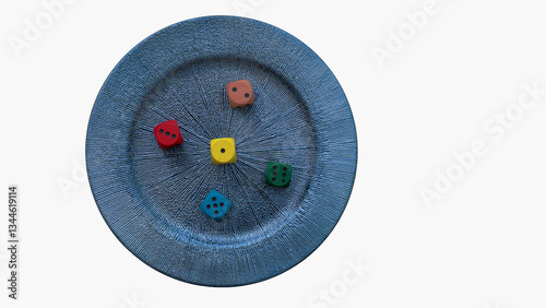 Obraz na płótnie Four colorful dice are scattered on a textured blue plate, symbolizing the interplay of chance and control w salonie