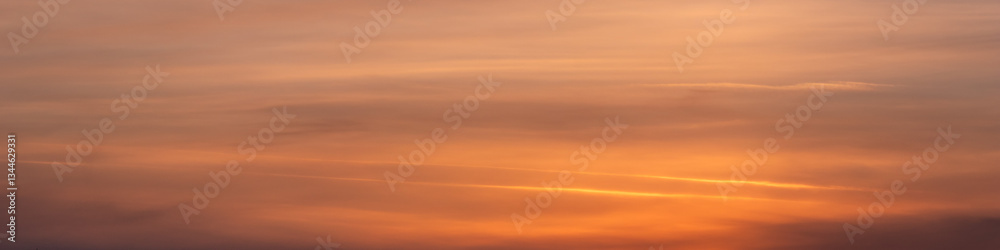 Obraz premium Epic Sunset View – Dramatic Clouds in Warm Orange and Pink Tones - Panoramic View