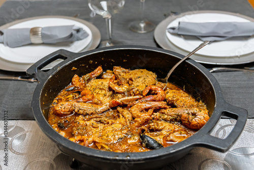 фотографія Close-up of zarzuela de marisco, a traditional Spanish seafood stew with shrimp, crab, mussels, and fish in a rich sauce
