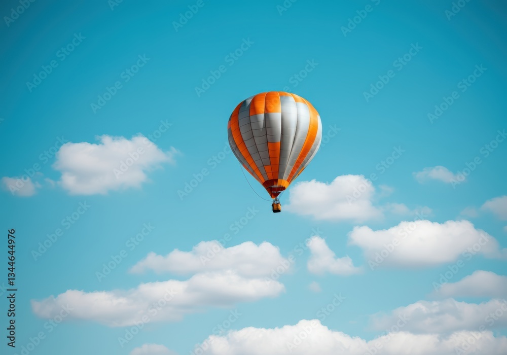 Naklejka premium Colorful hot air balloon soaring in a clear blue sky