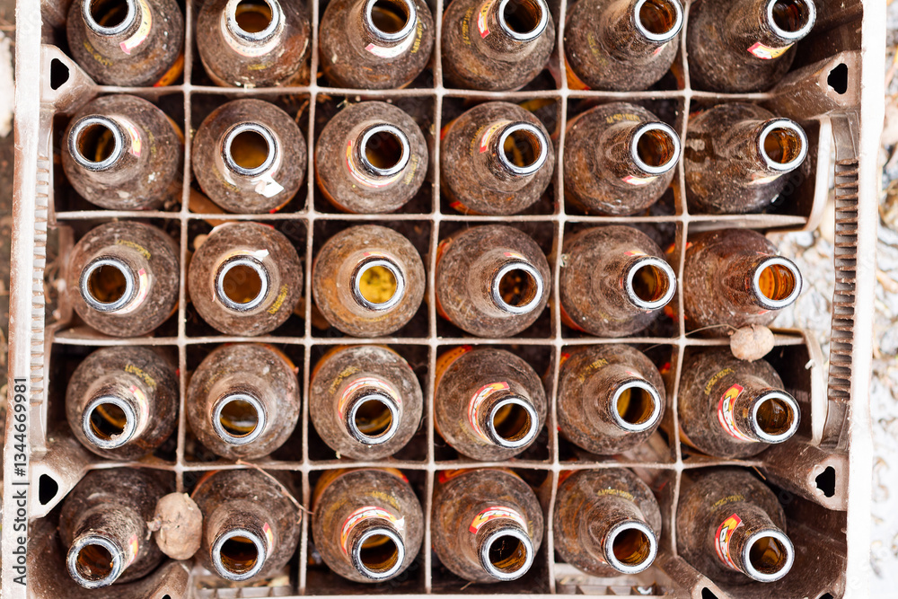 Fototapeta premium Vintage Beer Bottles in a Rustic Crate in Chocontá, Choconta, Cundinamarca,Colombia. A Unique Display of Recycling and Sustainable Practices