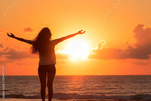 Woman standing by the sea during sunrise, practicing mindfulness and appreciating nature's beauty