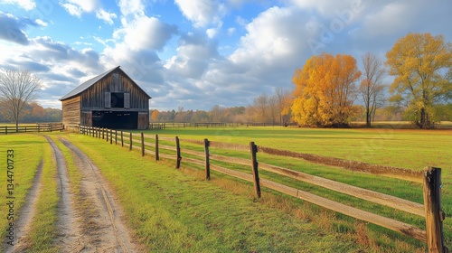 Charming Red Barn on a Tranquil Farm Surrounded by Lush Green Fields on a Sun...