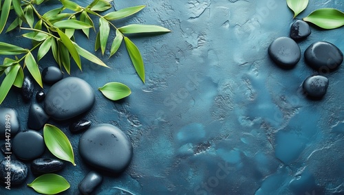 Relaxing Arrangement of Smooth Stones and Green Leaves on a Textured Surface