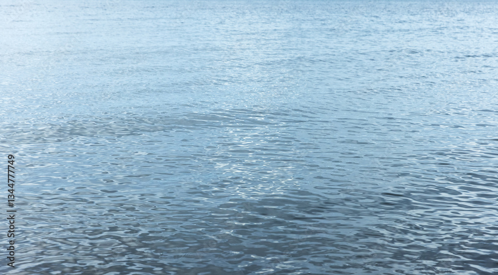 Serene blue ocean water with rippling waves under the daylight Serene blue ocean water with rippling waves under the daylight