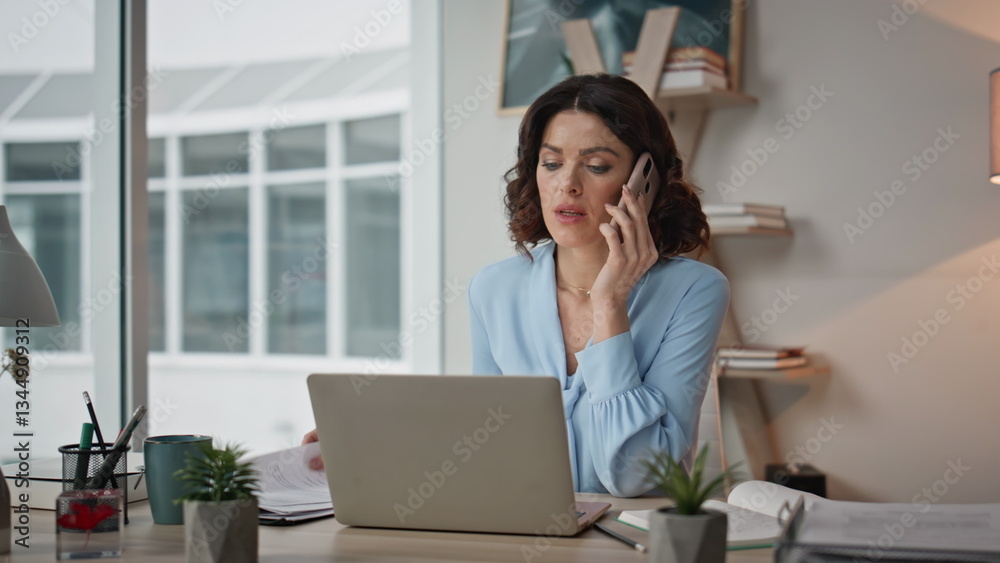 Serious woman cellphone call looking work documents at modern office closeup. Serious woman cellphone call looking work documents at modern office closeup.