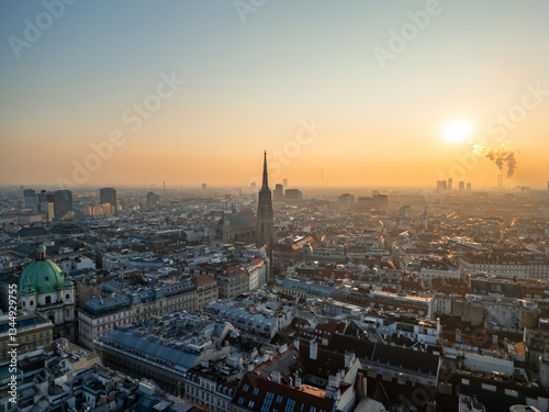 Vienna skyline with St. Stephen's Cathedral at sunrise, aerial view