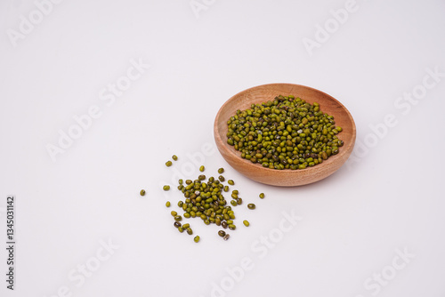 green beans in wooden bowl, isolated white background