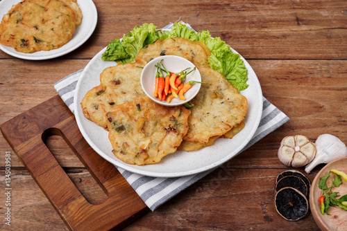 Bakwan sayur is a typical Indonesian vegetable fritter. The ingredients are made from wheat flour mixed with cabbage, carrots, and bean sprouts. Indonesian street food.