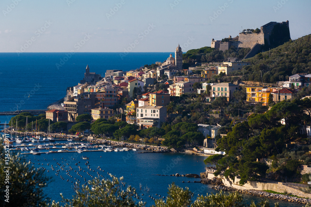 Fototapeta premium Portovenere La Spezia apartments and boats from sea view at Italy at sunny day..
